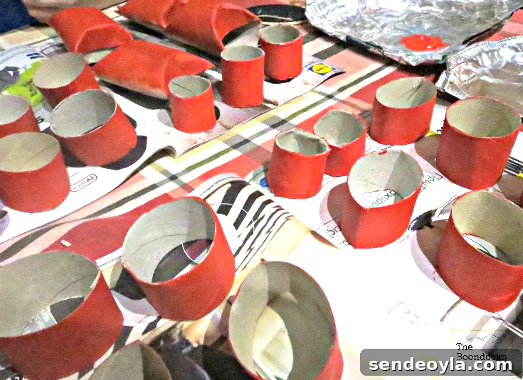 DIY Heart Wreath from Toilet Paper Rolls 3 Painting toilet paper rolls with red paint to make this heart craft.