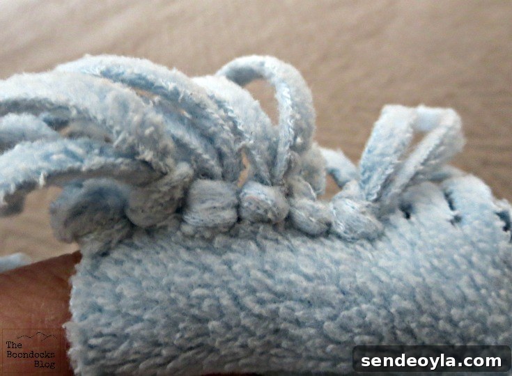 DIY Minimal-Sew Fleece Pillow 5 Fringes tied along the edge