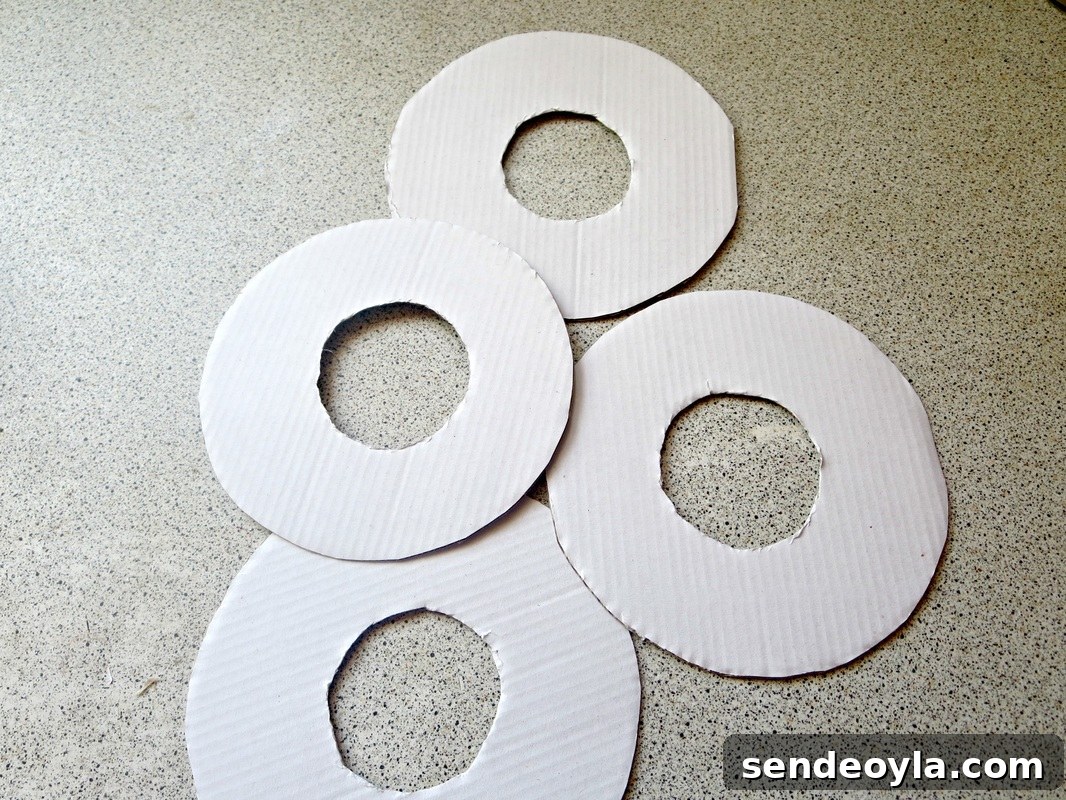 DIY Upcycled Christmas Ornaments from Scrap Ribbon 4 Stapling fabric to cardboard