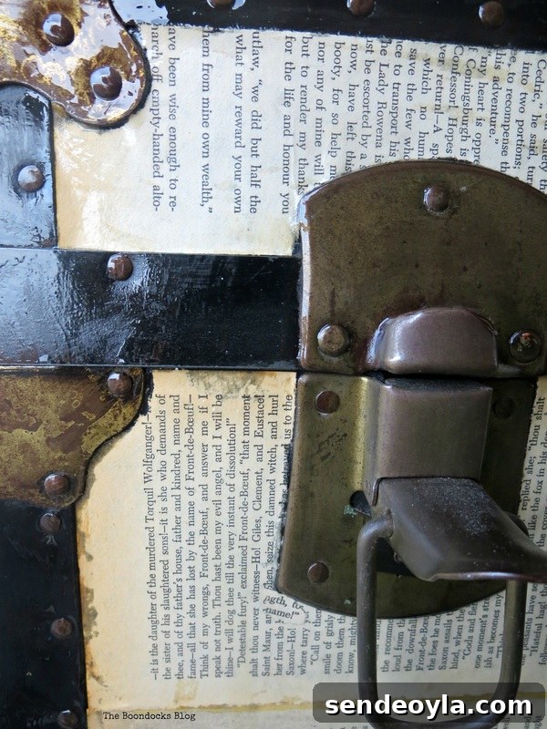 DIY Metal Trunk Makeover with Vintage Book Pages 11 Detail of old trunk covered in Book pages hardware The chivalrous Trunk www.theboondocksblog.com